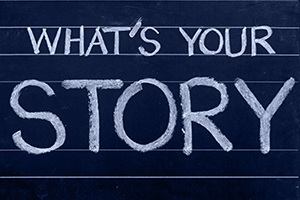 A chalkboard with the text "What's Your Story"